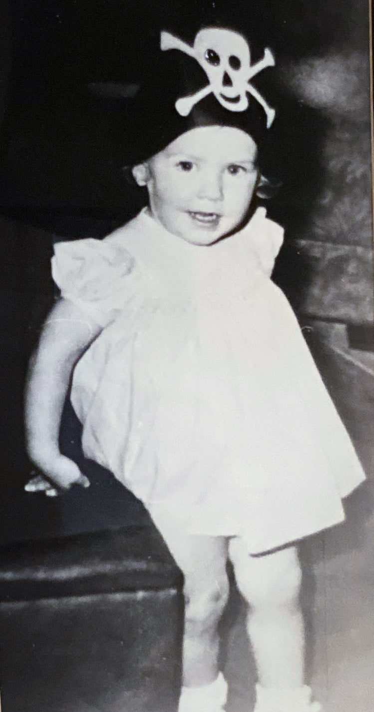 P.Susan Jackson (as a three-year-old). Studying the sconce in front of her.